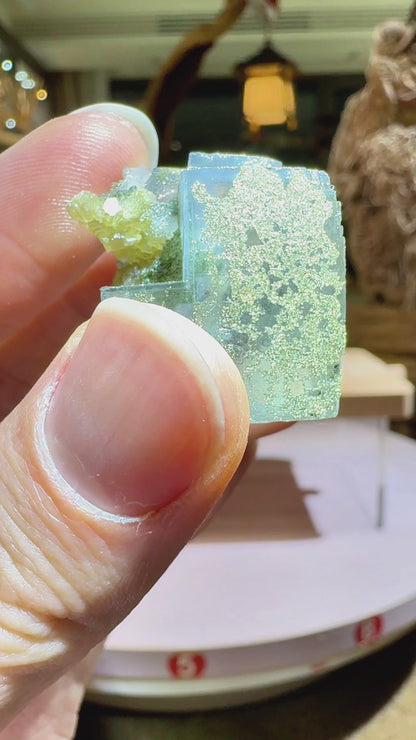 complete light green fluorite cube with shiny pyrite